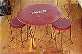 Wrought iron Child's Coca Cola table and two chairs 